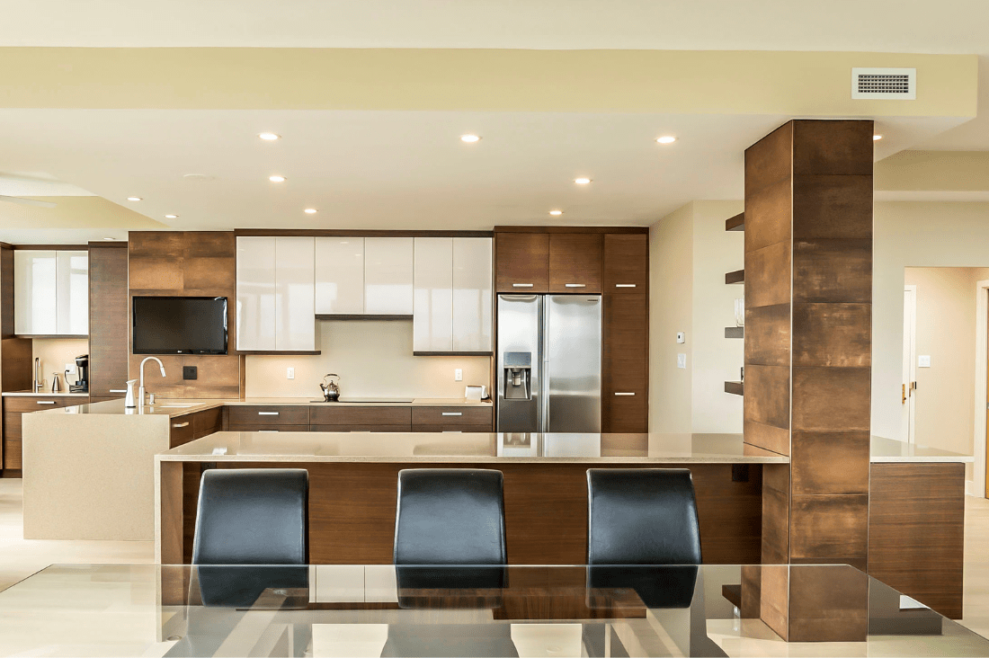 modern condo kitchen island with seamless integration into wall beam