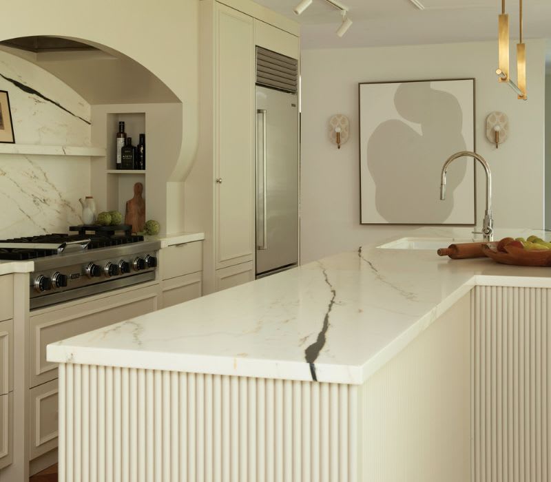 Cream Painted Kitchen Cabinets with Reeded Island