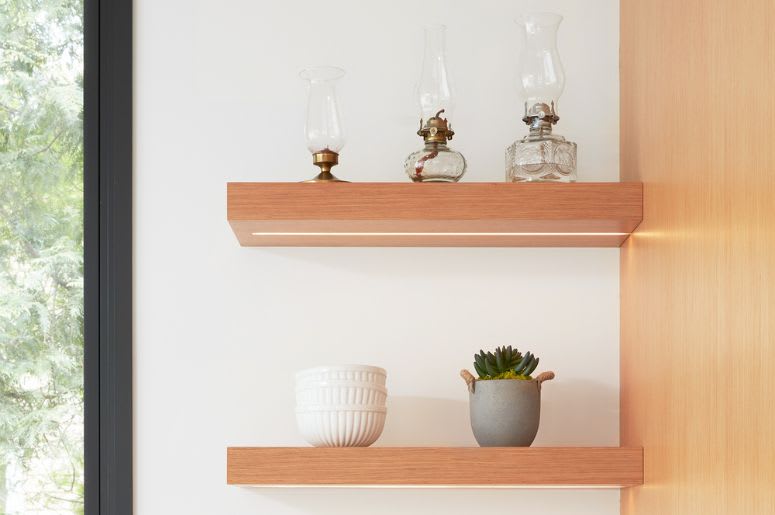 White oak floating shelves with underneath lights