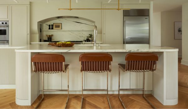 White kitchen with custom range hood