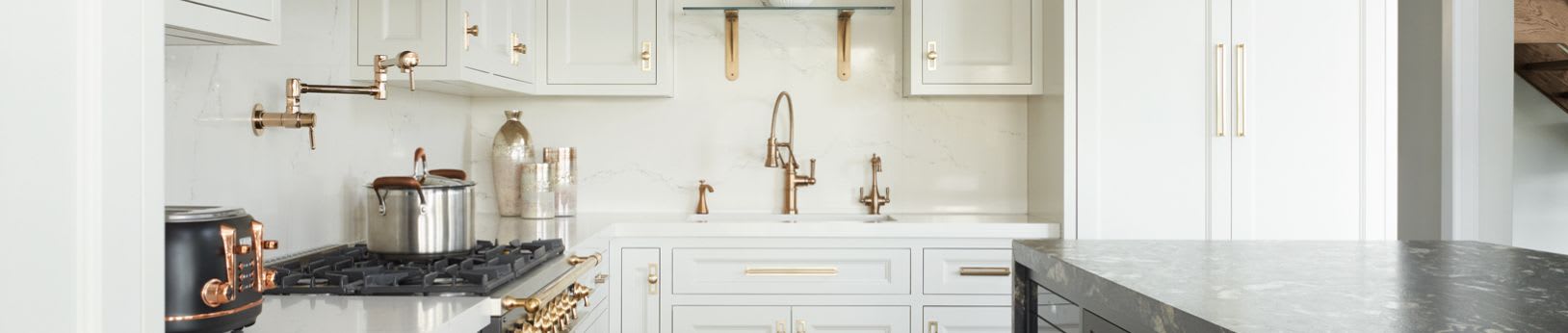 White kitchen cabinets with gold hardware