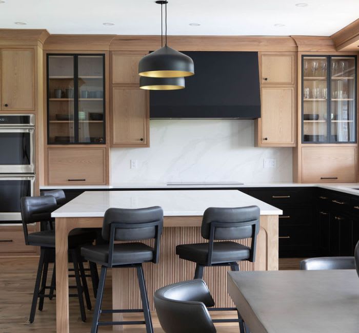 White oak custom kitchen with a mixture of black cabinet ahrdware