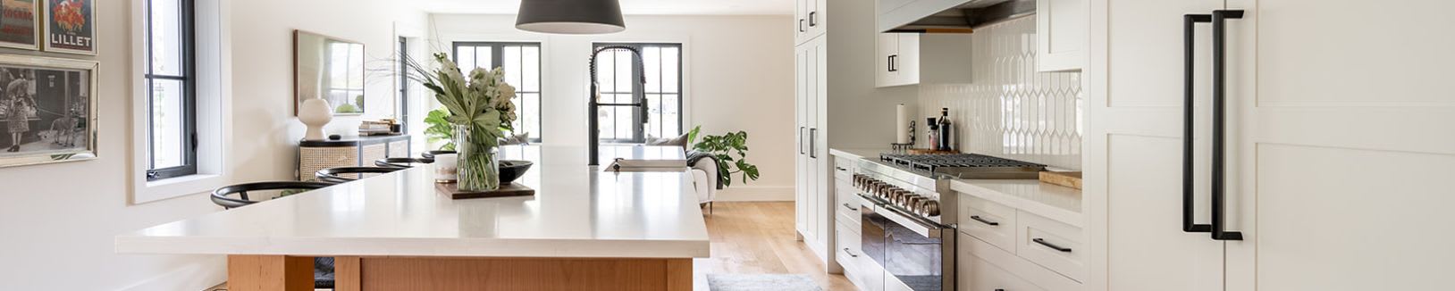 Modern white custom kitchen cabinets with centre island.