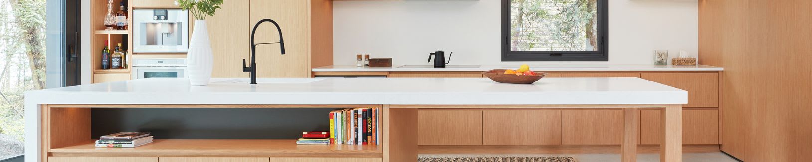 Modern wood kitchen built with custom storage solutions like open cabinets