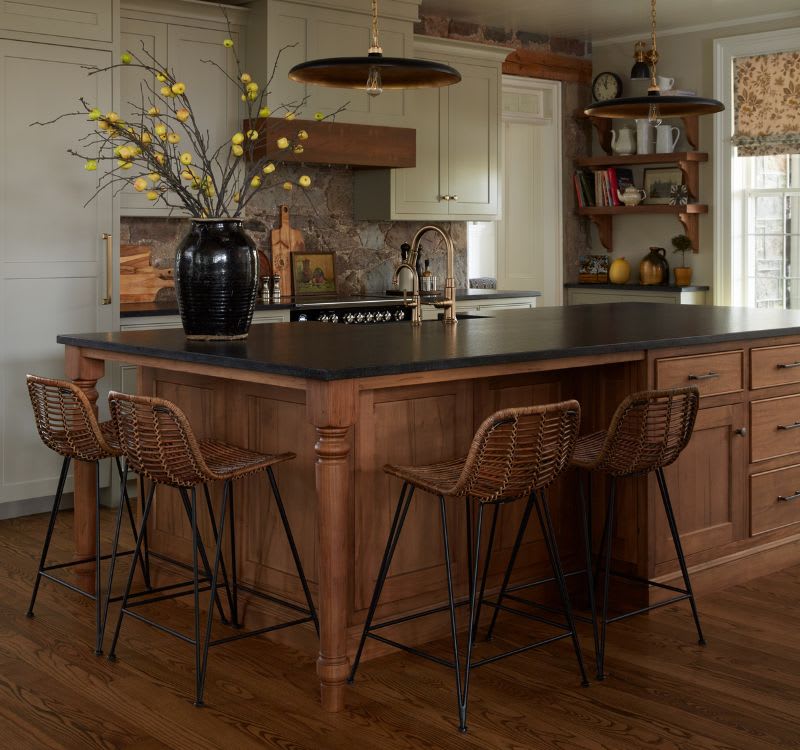 White cabinets with dark island kitchen design