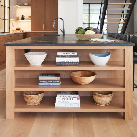 White oak kitchen island with open shelving for storage