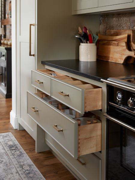 Close up of two kitchen cabinet drawers open