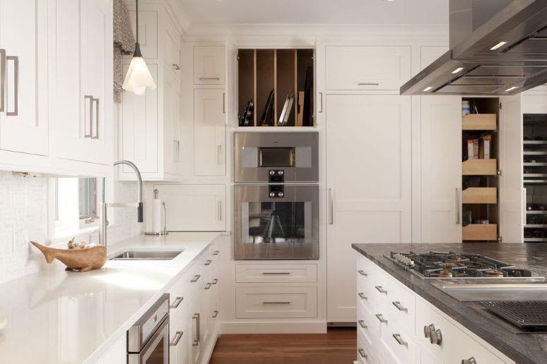 Baking sheet custom built storage in modern white kitchen