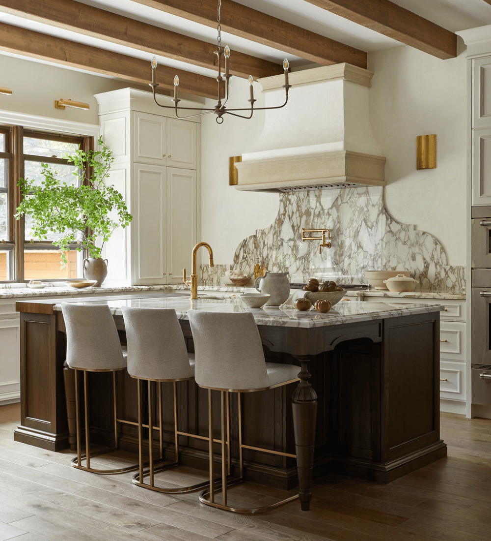 custom oakville kitchen with a dark brown stained island and light cream cabinets