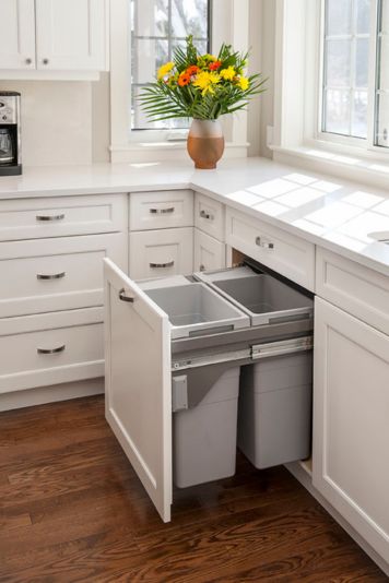 Modern custom recycling storage built into kitchen cabinets